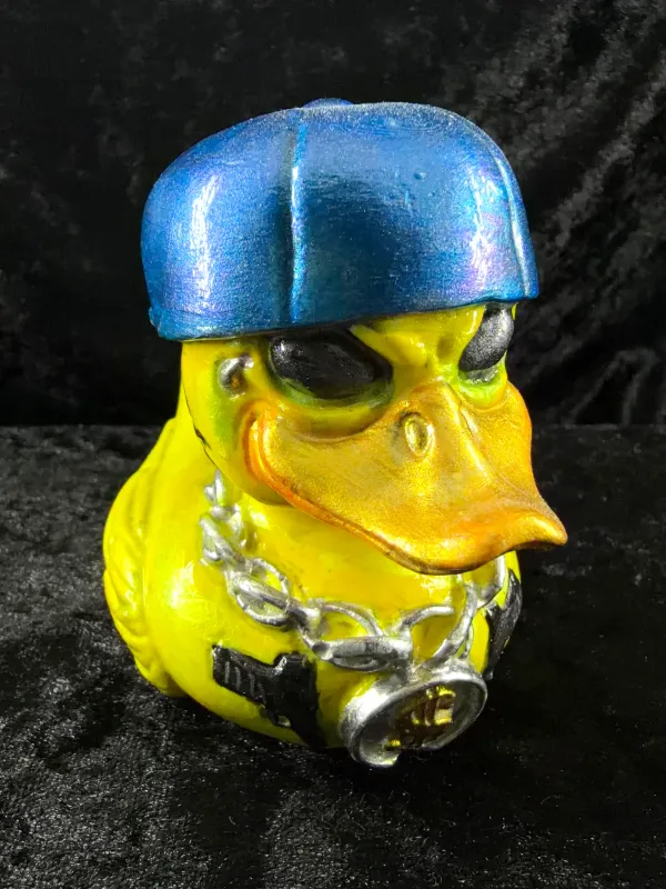 Hip-hop duck in a yellow cap and gold chain