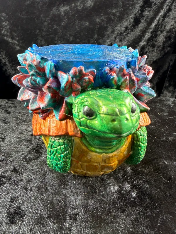 Green turtle planter with flowers