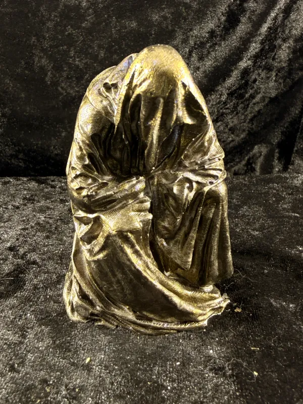 Gold hooded reaper figure